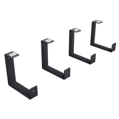 Set of four black metal brackets on a white background