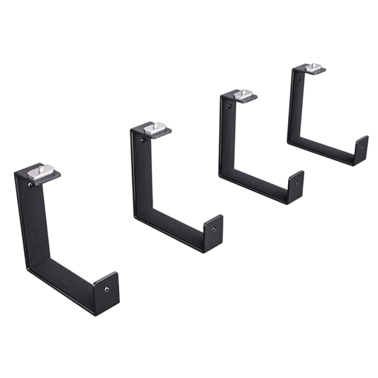 Set of four black metal brackets on a white background