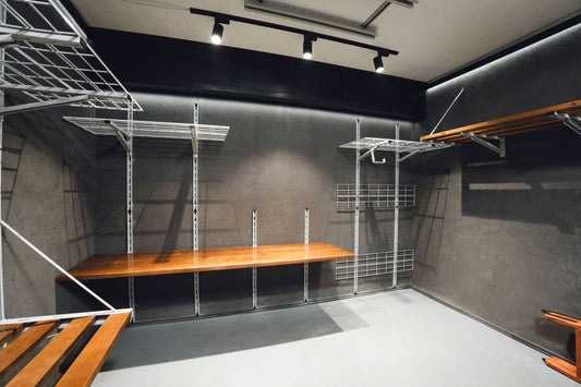 Modern storage room with metal shelving units and wooden platforms.