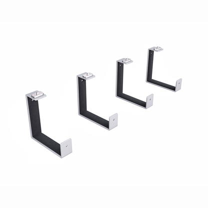 Set of four black metal brackets on a white background