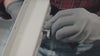 Video showing the sixth step of the Ezyrack Tote Master Pro installation, demonstrating the attachment of the side support brackets to the ceiling rails.