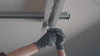 Video showing the final step of the Tote Master Pro installation, demonstrating how to securely slide and lock storage totes into the ceiling-mounted rail system.