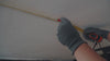 3D animation demonstrating the second step of the Ezyrack Tote Master Pro installation, showing the precise alignment and mounting of the steel support rails to the ceiling.