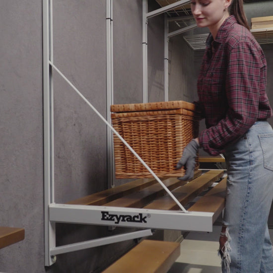 Video showing the Ezyrack Wall Master Pro storage system, featuring high-capacity steel shelving and hooks for organizing tools and garage equipment.
