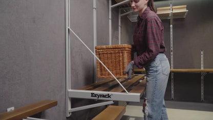 Video showing the Ezyrack Wall Master Pro storage system, featuring high-capacity steel shelving and hooks for organizing tools and garage equipment.
