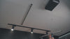 Video demonstrating the fourth step of the Ezyrack Tote Master Pro installation, showing the attachment of steel wall channels and end caps for structural support.